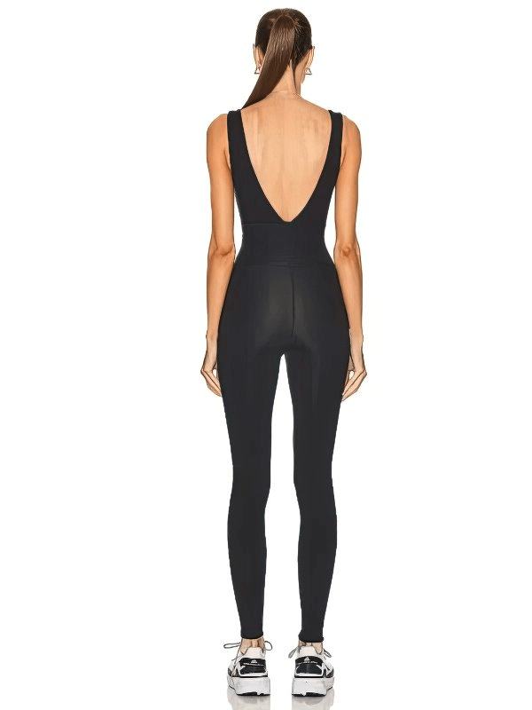 Woman wearing a black V-back sleeveless yoga jumpsuit, showcasing breathable and quick-dry fabric from the rear view.